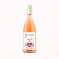 rosé natural wine bottle on a soft cotton-candy gradient