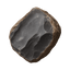 Close-up of a dark stone with a smooth, glossy surface, showcasing its natural texture and intricate patterns.