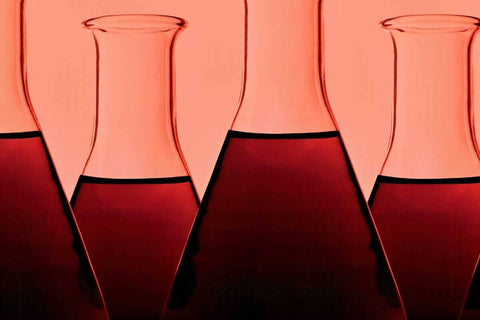 Some decanters with red wine in it, unfiltered wine natural wine blog.