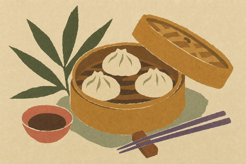 Paper-cutout illustration of a bamboo steamer of dumplings with chopsticks and a dish of soy sauce
