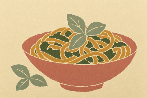 Paper-cutout illustration of a bowl of pasta with green pesto and basil leaves