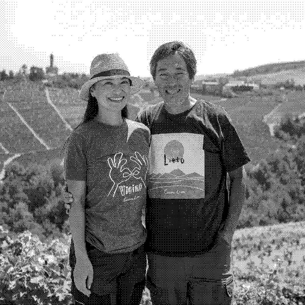 Rie and Hiroto Sasaki, natural wine producers of Cascina Lieto, in their vineyard in Castiglione Tinella, Piedmont, Italy