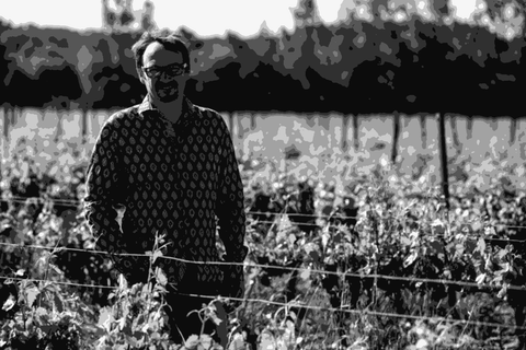 Winemaker Cyril Cuche standing among the vines at Château Puech Redon