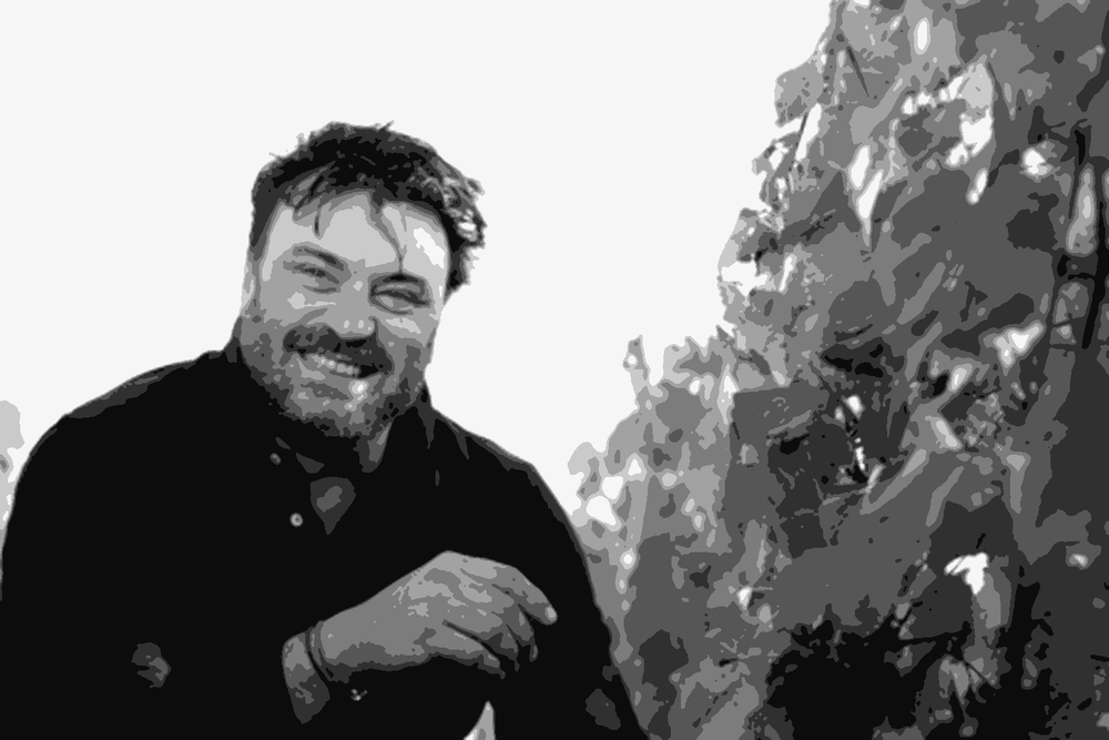 Winemaker Stéphane Dupuch crouching among grapevines at Château Sainte-Marie