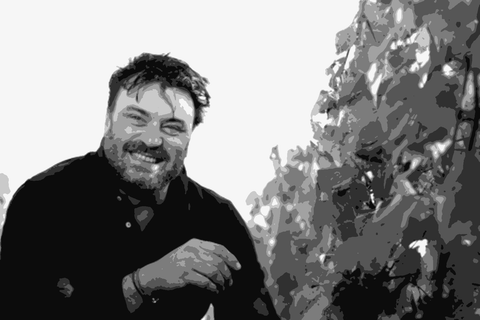 Winemaker Stéphane Dupuch crouching among grapevines at Château Sainte-Marie