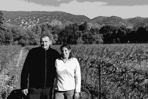 Alain and Agnès Carrère of Domaine Majas standing in their vineyard in Roussillon