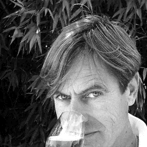 Hervé Dubourdieu, natural wine producer, tasting a glass of his white wine at Château Ducasse in Bordeaux, France