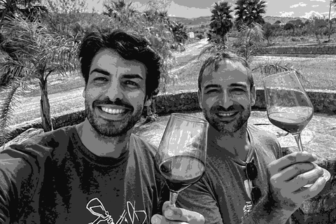 Elios founders Nicola and Guido raising glasses of natural wine in Sicily
