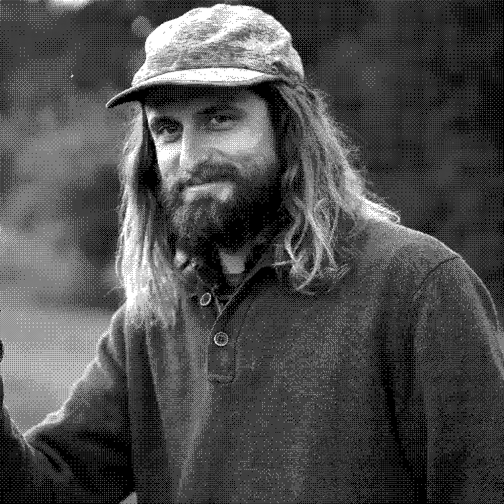 Fable Farm, natural wine producer in Barnard, Vermont, holding a glass of amber apple wine outdoors