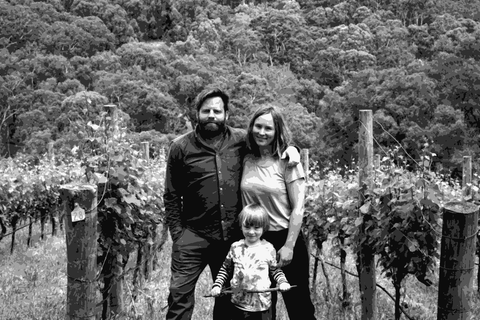 Gareth and Rainbo Belton of Gentle Folk standing with their child in their Basket Range vineyard