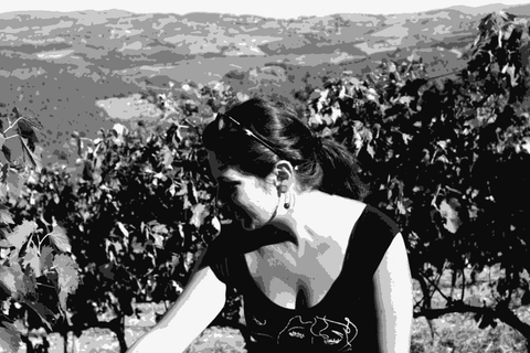 Angela Fronti of Istine among the vines above Radda in Chianti, with the Tuscan hills behind