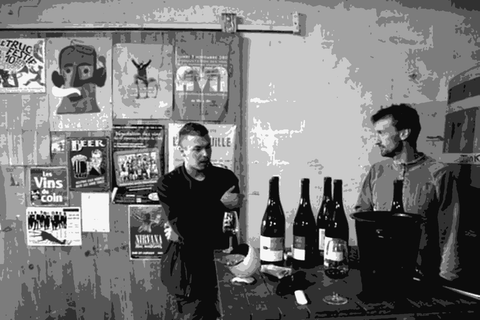 Jeremy Quastana standing in his cellar with bottles of his Loire natural wine