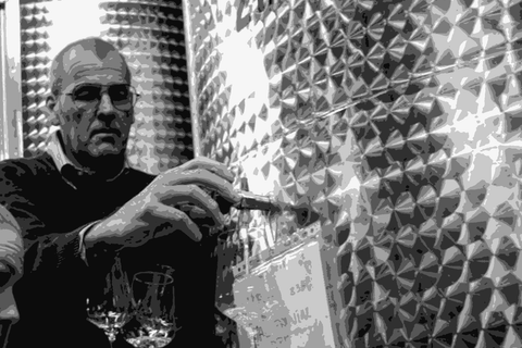Edi Kante drawing wine from tank in his cellar in the Carso, Italy