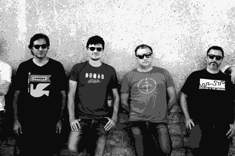 The seven-member La Cattiva collective standing outside their masseria in Sammichele di Bari, Puglia