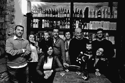 The Ruggeri family of Le Colture gathered in their wine cellar surrounded by bottles