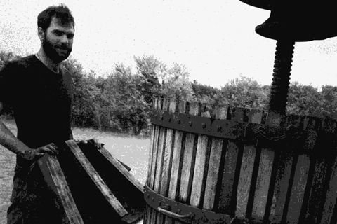 Benoit Joussot-Dubien of Les Terres Dubien at a traditional wooden wine press in the northern Medoc