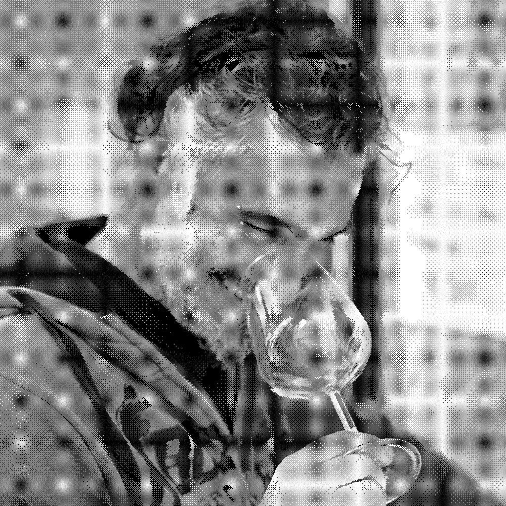 Luigi Stalteri, natural wine producer of Longarico, smelling a glass of wine in his cellar in Alcamo, western Sicily, Italy