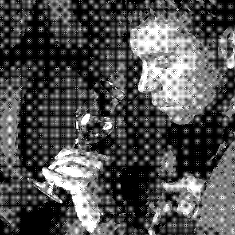 Giovanni Scaglione, natural wine producer of Forteto della Luja, nosing a glass of Moscato in his barrel cellar in Loazzolo, Piedmont, Italy