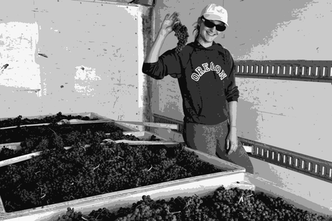 Megan Sekermestrovich of Lula holding freshly harvested Valdiguié grapes at the Richmond Wine Collective