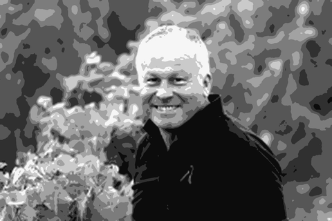 Etienne de Montille standing among the vines at Domaine de Montille in Volnay, Burgundy