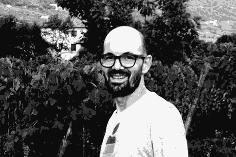 Mario Macciocca smiling in his vineyard in the Scalambra hills of Lazio, Italy