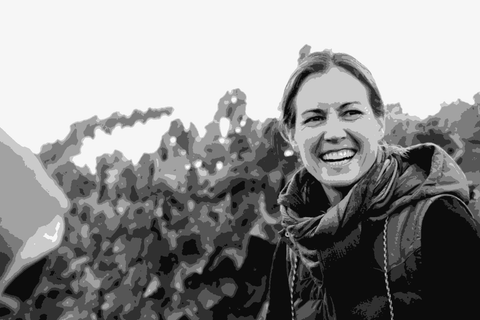 Martha Stoumen smiling at harvest time in a Northern California vineyard, working alongside her picking crew
