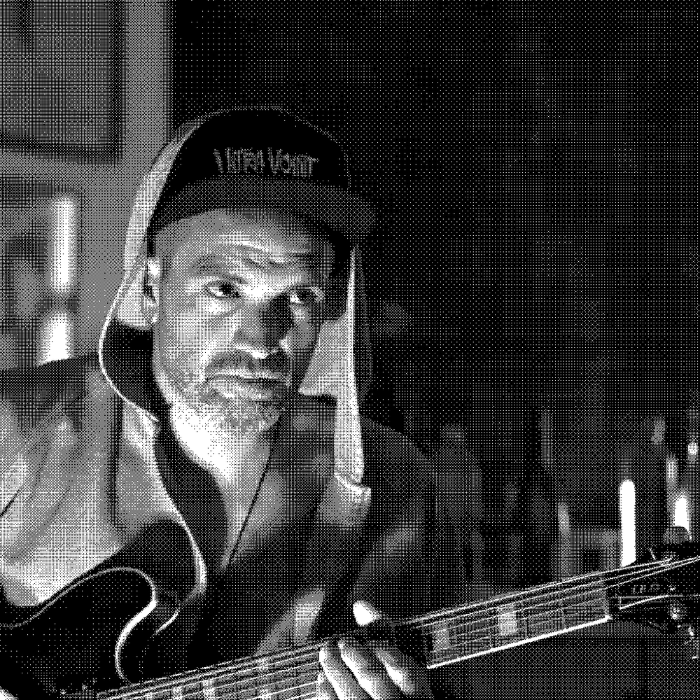 Mathias Guerrero Abras, natural wine producer of L'Erba d'Agram in Puilacher, Languedoc, France, playing guitar
