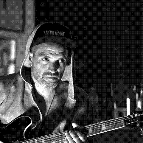 Mathias Guerrero Abras, natural wine producer of L'Erba d'Agram in Puilacher, Languedoc, France, playing guitar