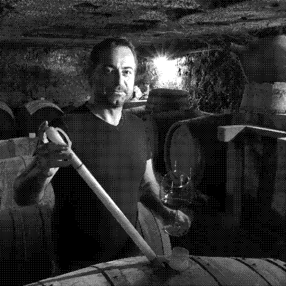 Poggio delle Baccanti, natural wine producer drawing wine from barrel in the cellar, Campania, Italy