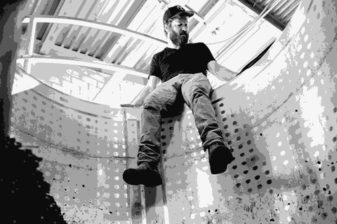 Dieter Cronje winemaker of Riding Monkey and Presqu'ile Winery inside a fermentation tank in California