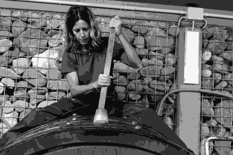 Lidia Carbonetti of Rocco di Carpeneto working on a large wooden fermentation vessel in the cellar