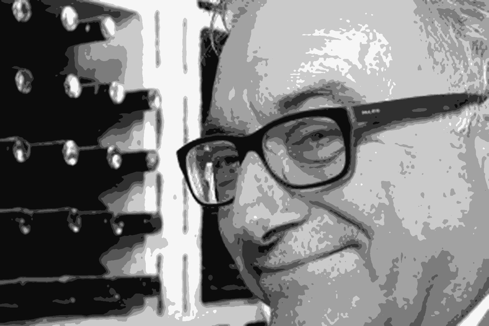 Antonello Rovellotti, winemaker and owner of Rovellotti in Ghemme, standing in the cellar among wine bottles