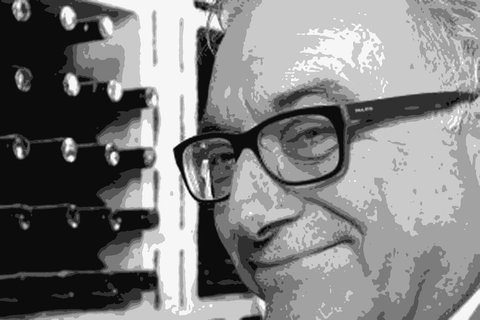 Antonello Rovellotti, winemaker and owner of Rovellotti in Ghemme, standing in the cellar among wine bottles