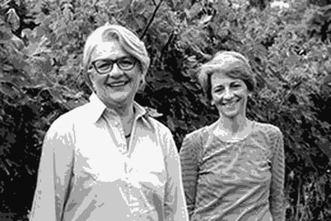 Sisters Antonella and Ersiliana Bronca standing in their Valdobbiadene vineyards among ripe Glera clusters