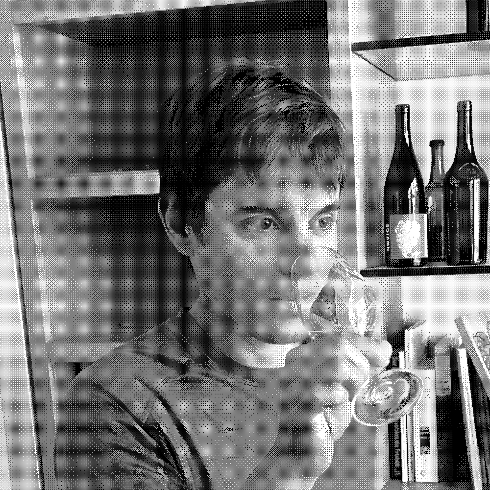 Valentin Morel, natural wine producer, tasting wine in his cellar in Poligny, Jura, France
