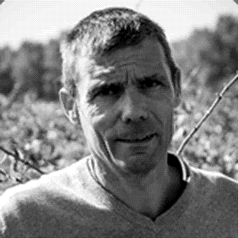 Christophe Aguilar, natural wine producer at Domaine de la Patience in Costieres de Nimes, France, standing in his vineyard