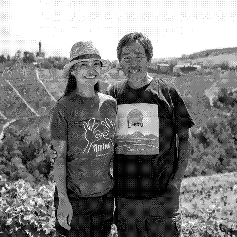 Rie and Hiroto Sasaki, natural wine producers of Cascina Lieto, in their vineyard in Castiglione Tinella, Piedmont, Italy