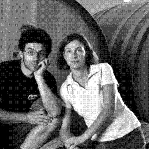 Fausto and Cinzia Cellario of Poderi Cellario, natural wine producers, in their barrel cellar in Carru, Piedmont, Italy