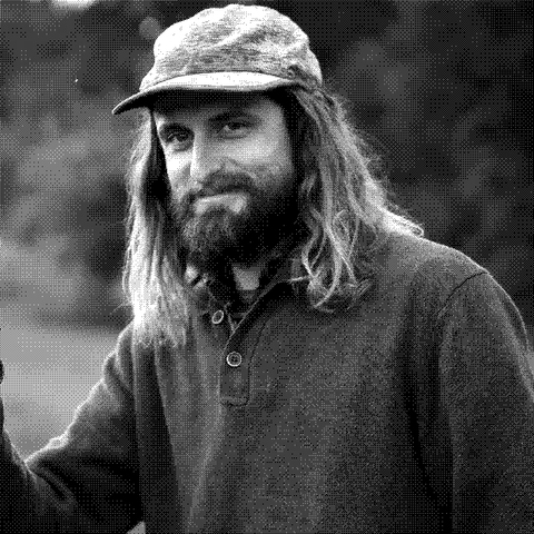 Fable Farm, natural wine producer in Barnard, Vermont, holding a glass of amber apple wine outdoors