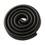Close-up of a black spiral rubber hose rolled into a coil, ideal for various applications.